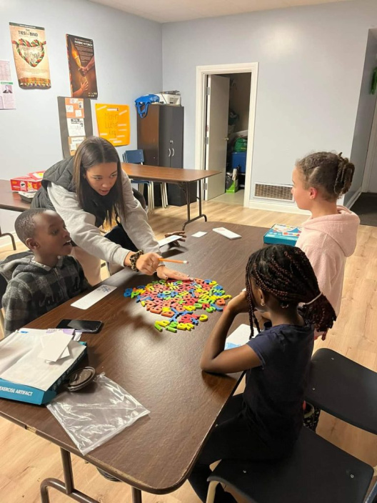Image of adult tutoring youth