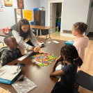 Image of adult tutoring youth